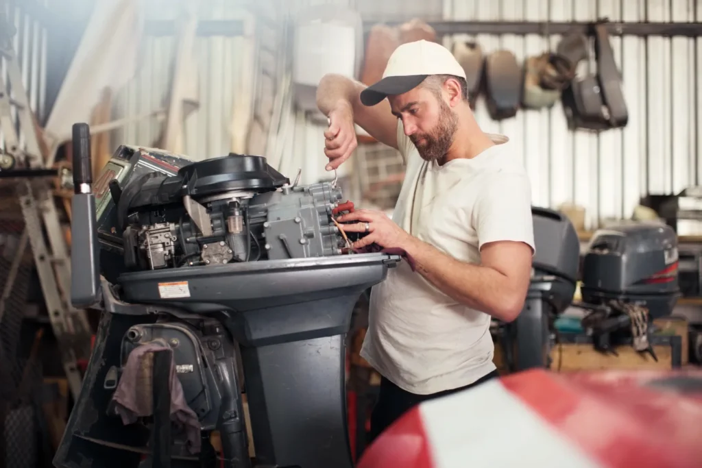 A man repairing a blown engine