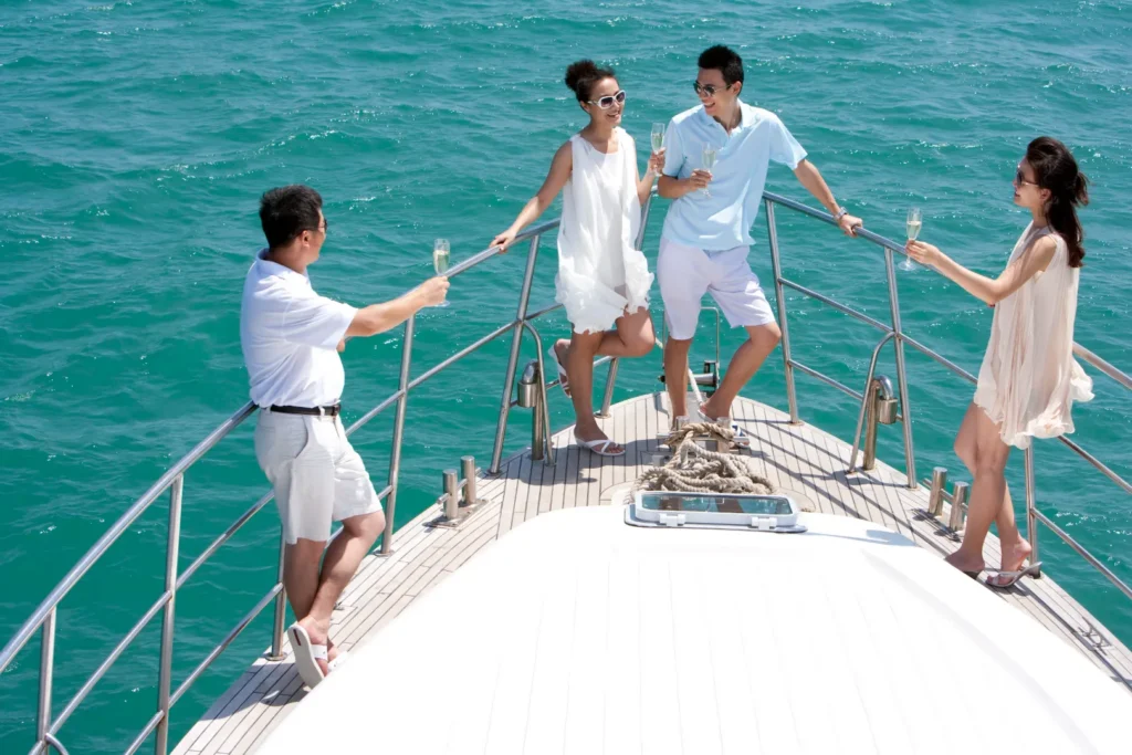 People enjoying drinks on a yacht during a leisure trip